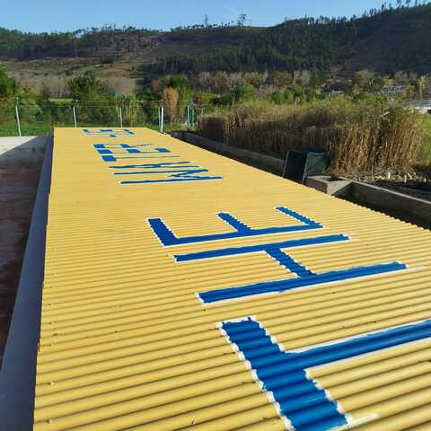 THE WATER HUB painted on the irrigation dam roof (June 2026)