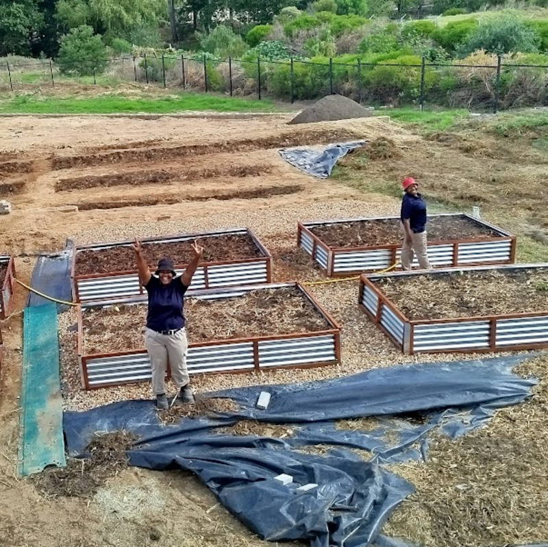 Building the food gardens with Ms Ester Buyambo and Ms Bongiwe Buyambo